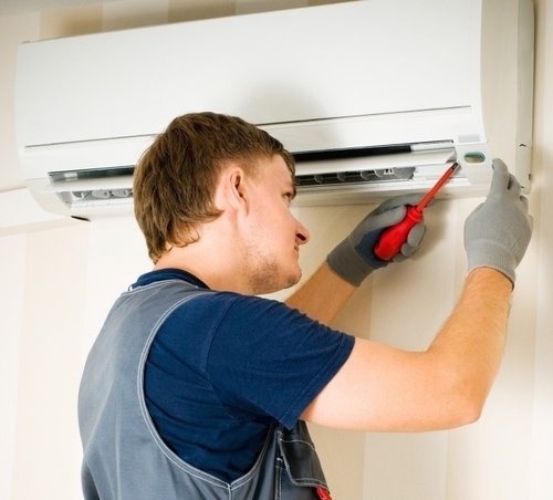 man_installing_a_heat_pump