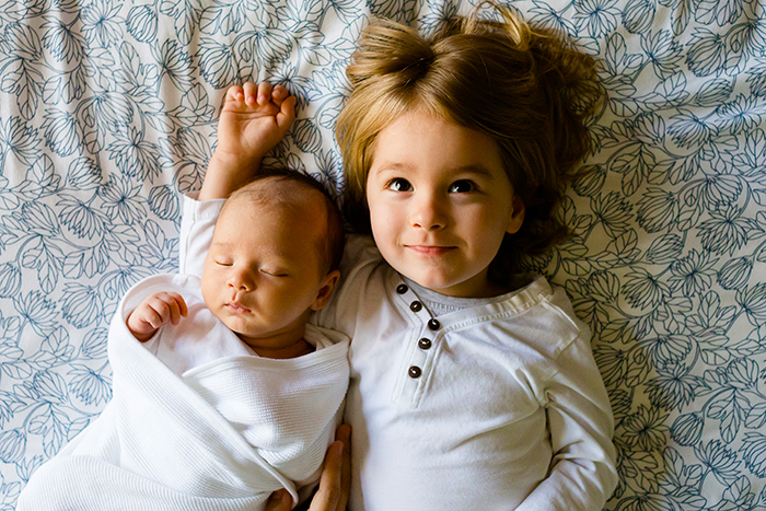 brother with newborn