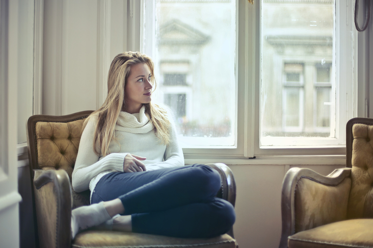 woman sitting on couch